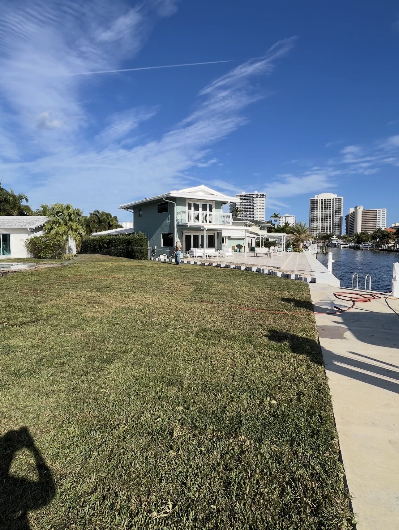 Completed sod installation across the waterfront lawn beside the seawall